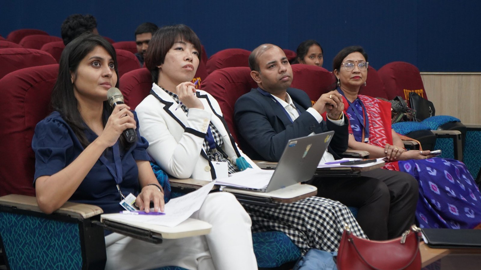 Participants attending a conference session
